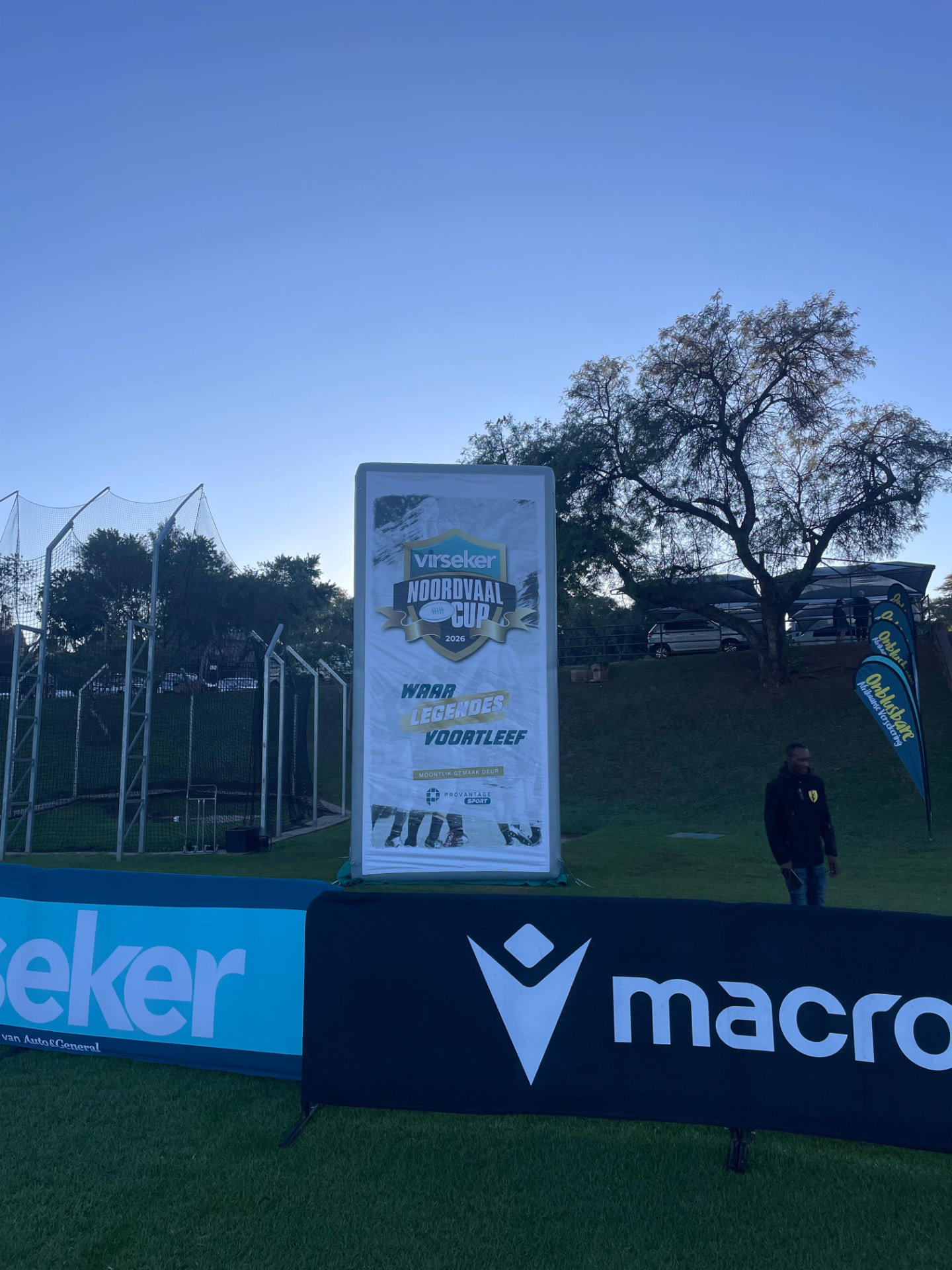 Inflatable Virseker Noordvaal Cup billboard at dusk on a sports field